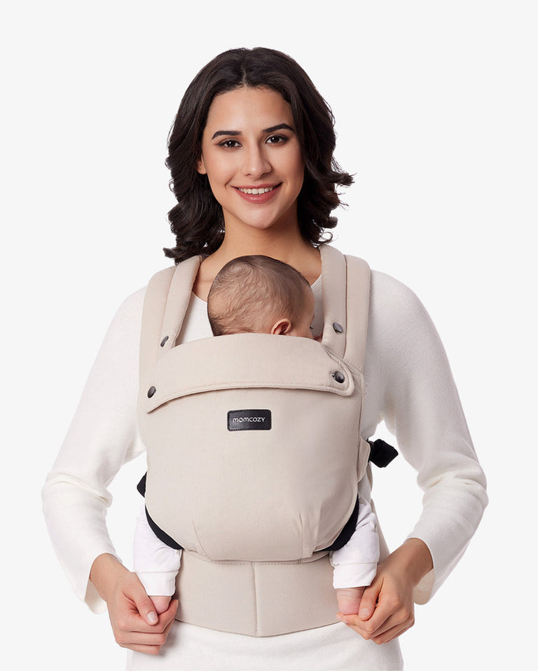 Translation missing: en.Momcozy PureHug Baby Carrier in Khaki, showcasing a baby being carried comfortably by a mother